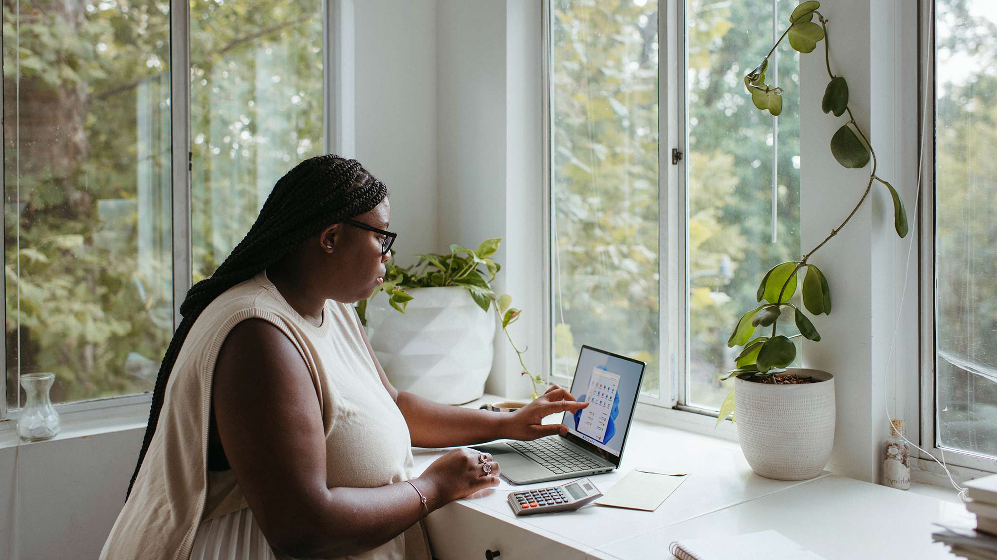 Working From Home Can Be Lonely – But Doesn’t Have To Be Photograph Of Woman Sitting Alone In Home Office, Working At A Laptop Computer